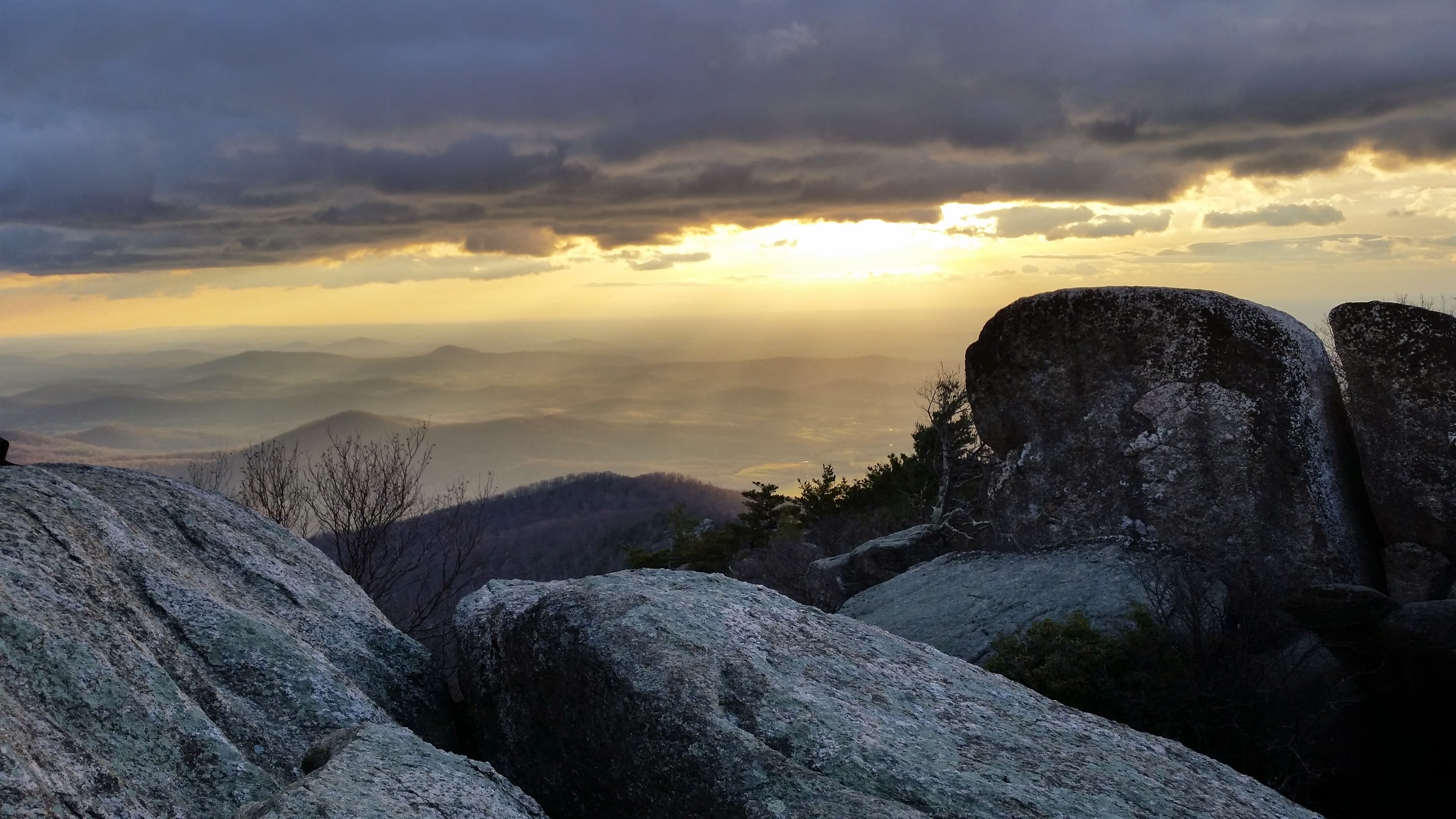 Sunrise over the Shenadoah mountains from the peak of Old Rag Mountain.